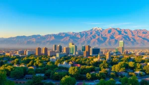 Showcasing a panoramic view of Almaty, Kazakhstan, with stunning mountains and city skyline at sunset, as seen on https://albmaftoh.com.