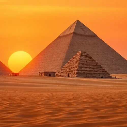 Piraminds rising majestically under a vibrant sunset, showcasing ancient Egyptian architecture.